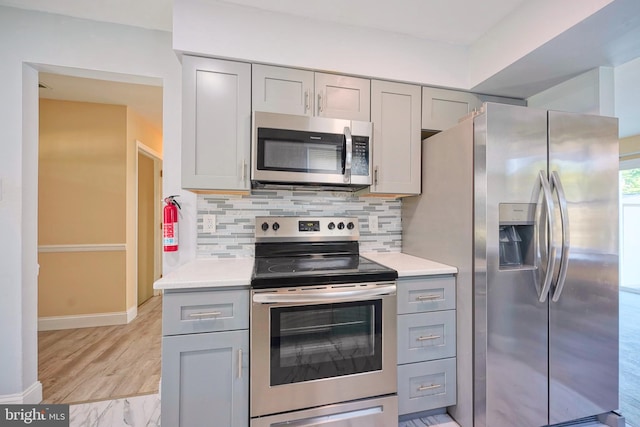 16 Franklin Dr, Voorhees, NJ 08043 - kitchen featuring appliances with stainless steel finishes, gray cabinetry, and light countertops