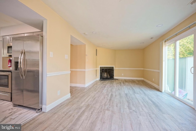 16 Franklin Dr, Voorhees, NJ 08043 - unfurnished living room featuring a fireplace and light wood-style floors