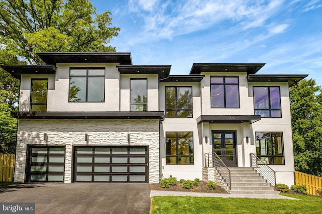 1710 Fairview Ave, Mclean, VA 22101 - contemporary house with stucco siding, stone siding, an attached garage, and french doors