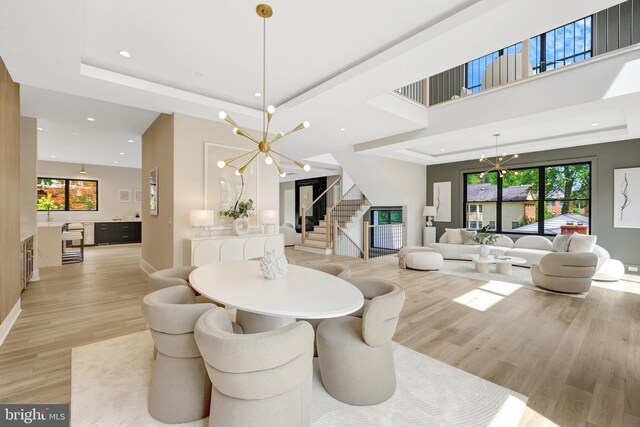 1710 Fairview Ave, Mclean, VA 22101 - dining space with a chandelier, stairway, light wood finished floors, recessed lighting, and a raised ceiling
