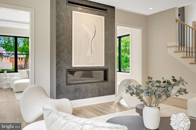 1710 Fairview Ave, Mclean, VA 22101 - living area with wood finished floors, stairs, a fireplace, and recessed lighting