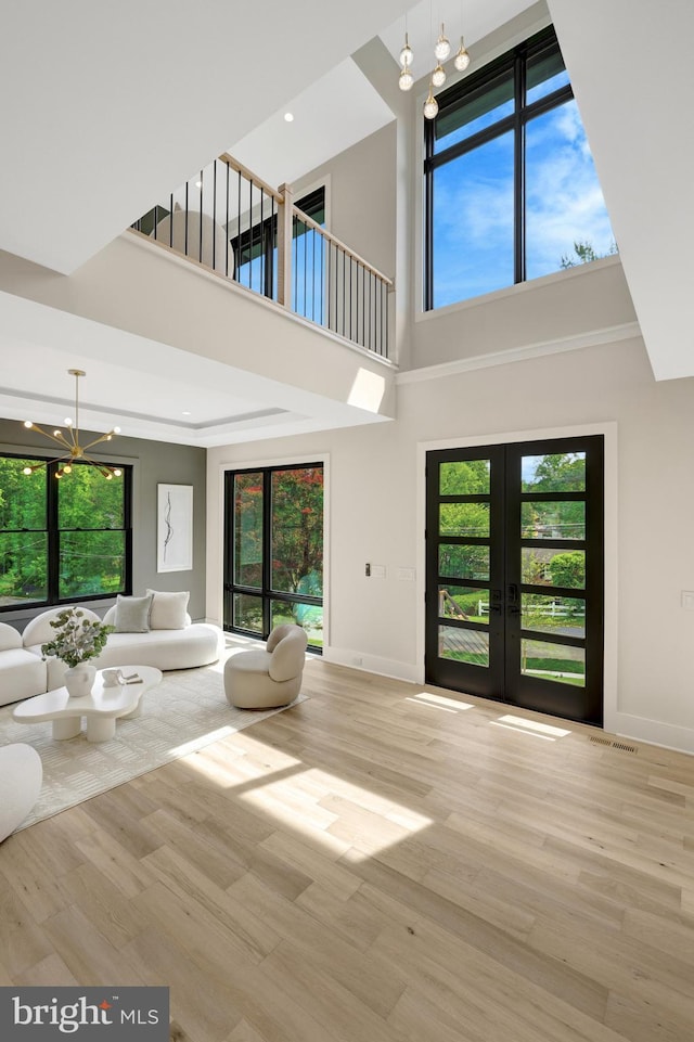 1710 Fairview Ave, Mclean, VA 22101 - living area with a chandelier, french doors, a high ceiling, wood finished floors, and healthy amount of natural light