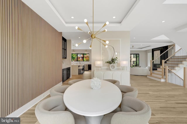 1710 Fairview Ave, Mclean, VA 22101 - dining space featuring a raised ceiling, light wood-type flooring, stairway, a premium fireplace, and recessed lighting