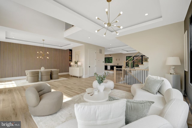 1710 Fairview Ave, Mclean, VA 22101 - living area with a chandelier, a tray ceiling, stairway, light wood-type flooring, and recessed lighting