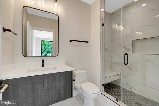 1710 Fairview Ave, Mclean, VA 22101 - bathroom featuring marble look tiles, vanity, and a marble finish shower