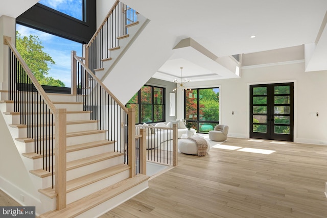 1710 Fairview Ave, Mclean, VA 22101 - stairs featuring french doors, wood finished floors, a chandelier, ornamental molding, and recessed lighting