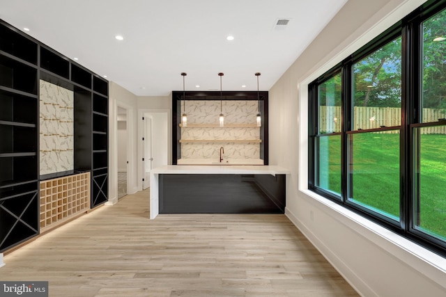 1710 Fairview Ave, Mclean, VA 22101 - bar area featuring light wood-style floors, built in shelves, pendant lighting, and recessed lighting