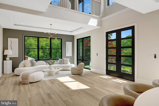 1710 Fairview Ave, Mclean, VA 22101 - living room featuring french doors, wood finished floors, a raised ceiling, a chandelier, and recessed lighting