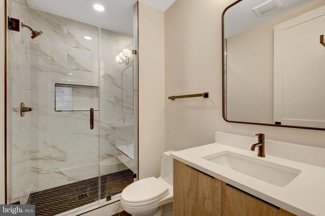 1710 Fairview Ave, Mclean, VA 22101 - bathroom featuring a marble finish shower, vanity, and recessed lighting