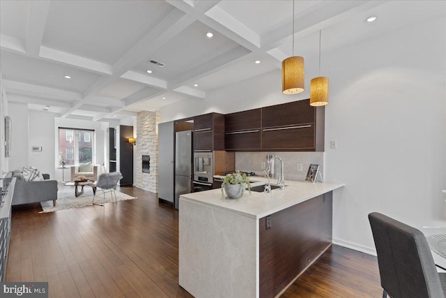 2223 1st St NW Unit 1, Washington, DC 20001 - kitchen with coffered ceiling, modern cabinets, beamed ceiling, light countertops, and open floor plan