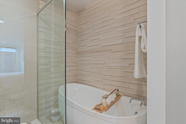 2223 1st St NW Unit 1, Washington, DC 20001 - full bathroom featuring a freestanding tub, tile walls, and a tile shower
