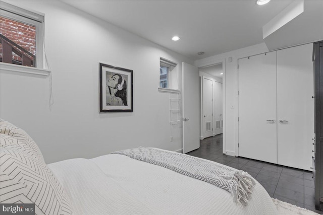 2223 1st St NW Unit 1, Washington, DC 20001 - bedroom with recessed lighting, dark tile patterned floors, and a closet