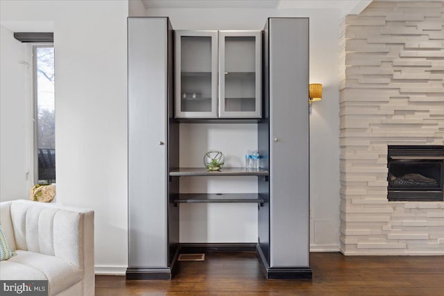 2223 1st St NW Unit 1, Washington, DC 20001 - bar area featuring dark wood-style flooring and a fireplace