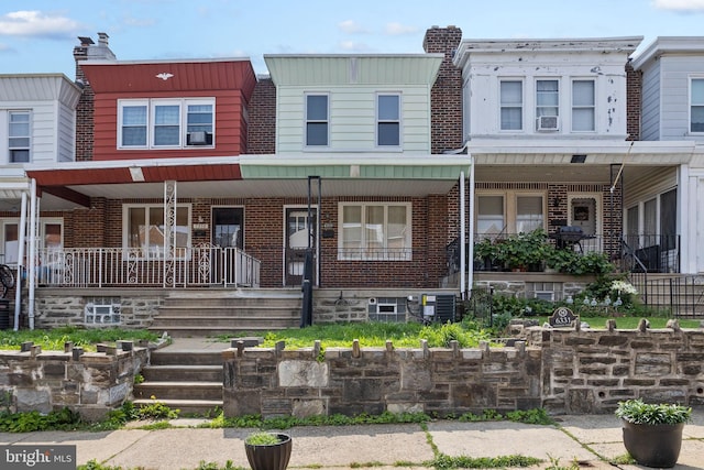 6333 Mershon St, Philadelphia, PA 19149 - view of property featuring brick siding and covered porch