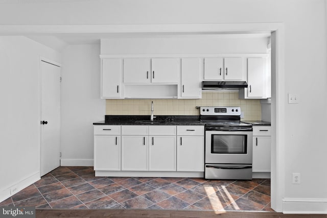 6333 Mershon St, Philadelphia, PA 19149 - kitchen with stainless steel electric range oven, under cabinet range hood, dark countertops, white cabinetry, and backsplash