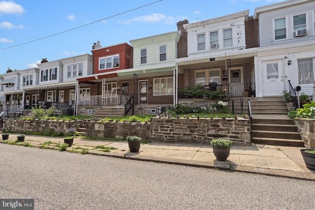 6333 Mershon St, Philadelphia, PA 19149 - multi unit property featuring brick siding, covered porch, a residential view, and cooling unit
