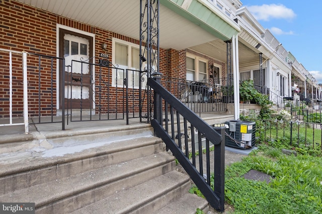 6333 Mershon St, Philadelphia, PA 19149 - property entrance featuring a porch and brick siding