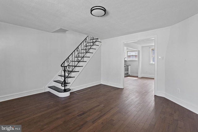 6333 Mershon St, Philadelphia, PA 19149 - unfurnished living room with stairway, dark wood finished floors, and a textured ceiling