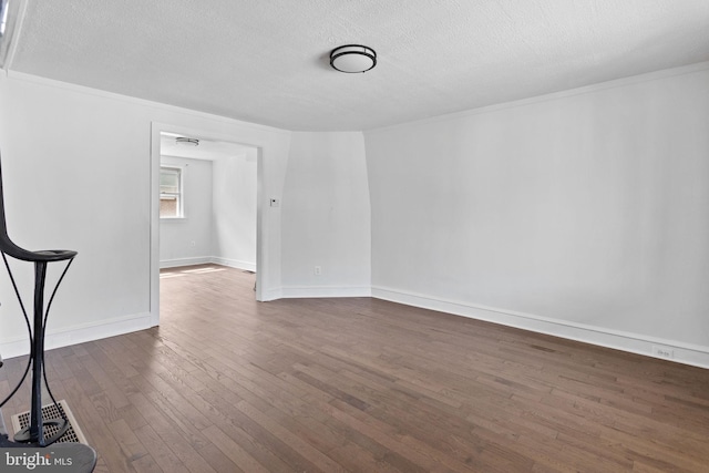 6333 Mershon St, Philadelphia, PA 19149 - spare room with dark wood-style floors, a textured ceiling, and crown molding