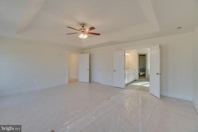 2 Bluebird Ln, Stafford, VA 22554 - unfurnished bedroom with a tray ceiling, ensuite bathroom, and a ceiling fan