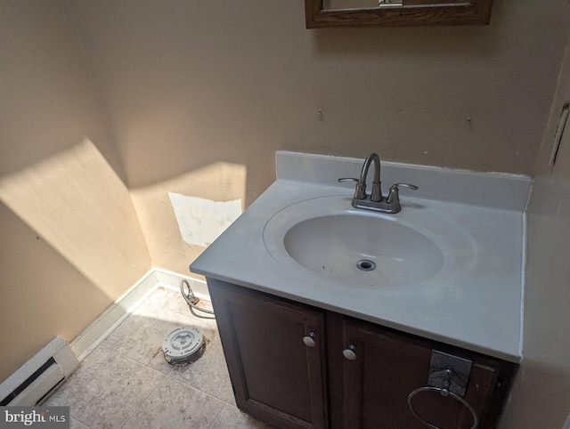 112 E 4th St, Seaford, DE 19973 - bathroom featuring vanity, a baseboard radiator, and tile patterned floors