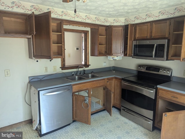 112 E 4th St, Seaford, DE 19973 - kitchen with appliances with stainless steel finishes, open shelves, light flooring, and dark countertops
