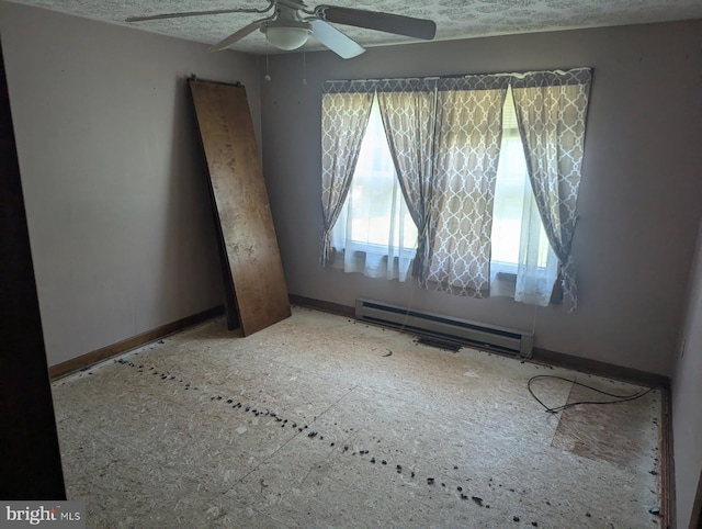 112 E 4th St, Seaford, DE 19973 - empty room with baseboard heating and ceiling fan