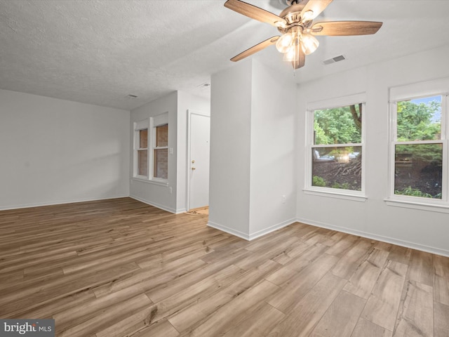 7607 Weather Worn Way Unit A, Columbia, MD 21046 - spare room featuring light wood-style flooring, a ceiling fan, and a textured ceiling