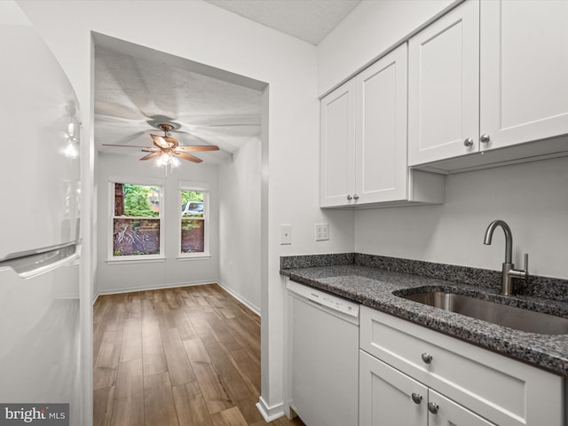 7607 Weather Worn Way Unit A, Columbia, MD 21046 - kitchen with white appliances, ceiling fan, white cabinets, dark stone counters, and wood finished floors