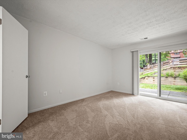 7607 Weather Worn Way Unit A, Columbia, MD 21046 - carpeted empty room with a textured ceiling