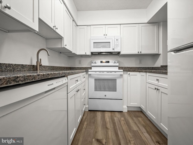 7607 Weather Worn Way Unit A, Columbia, MD 21046 - kitchen with white appliances, dark wood-style flooring, white cabinetry, and dark stone countertops