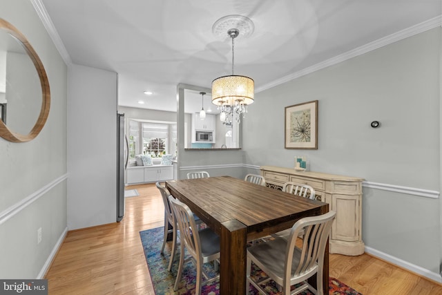 10034 Park Woods Ln, Burke, VA 22015 - dining area featuring a chandelier, light wood-style floors, and crown molding