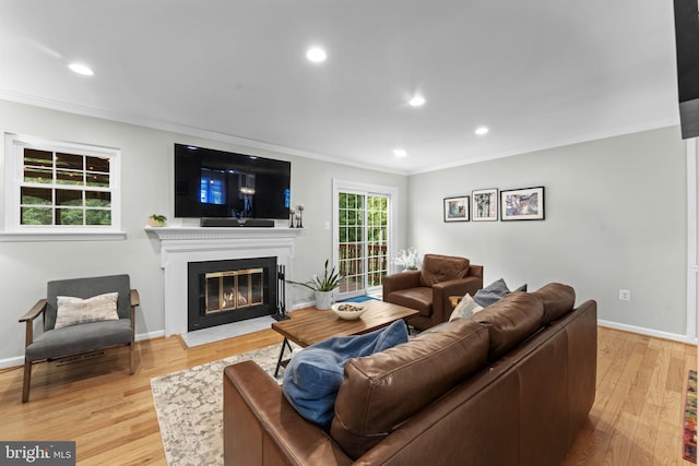 10034 Park Woods Ln, Burke, VA 22015 - living area featuring crown molding, a fireplace with flush hearth, wood finished floors, and recessed lighting