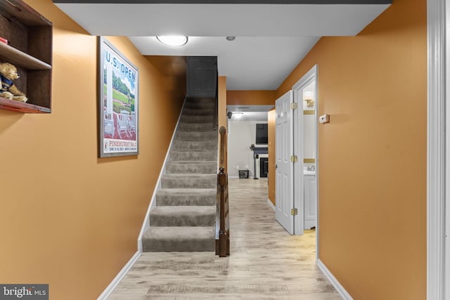 10034 Park Woods Ln, Burke, VA 22015 - staircase with wood finished floors and baseboards