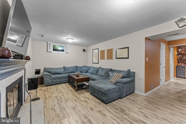 10034 Park Woods Ln, Burke, VA 22015 - living room featuring light wood-style floors and a fireplace