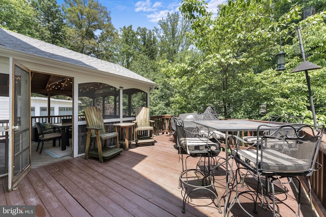 10034 Park Woods Ln, Burke, VA 22015 - deck featuring outdoor dining area and view of wooded area