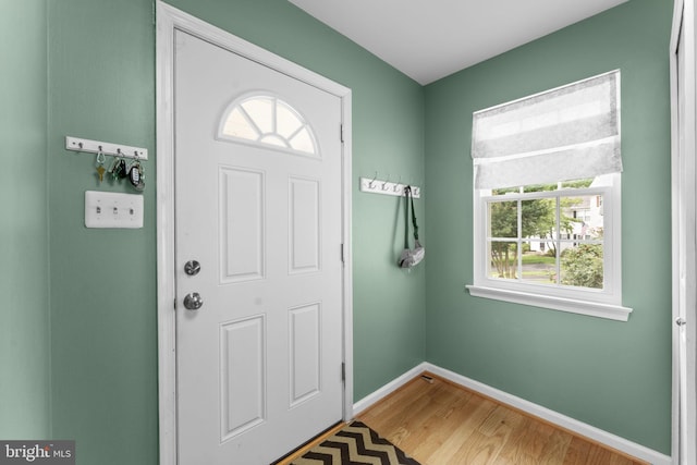10034 Park Woods Ln, Burke, VA 22015 - entryway with light wood-style flooring and baseboards