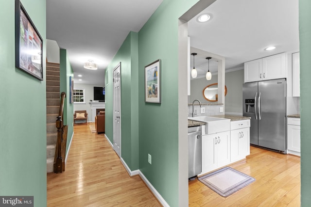 10034 Park Woods Ln, Burke, VA 22015 - corridor featuring light wood-type flooring, recessed lighting, and stairway