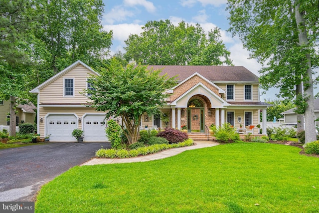 4 Surrey Rd, Rehoboth Beach, DE 19971 - traditional home featuring driveway, an attached garage, a front lawn, and covered porch