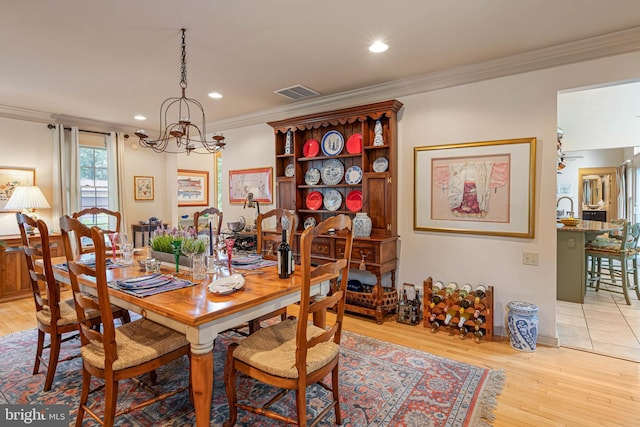 4 Surrey Rd, Rehoboth Beach, DE 19971 - dining space featuring a chandelier, ornamental molding, light wood-type flooring, recessed lighting, and a ceiling fan