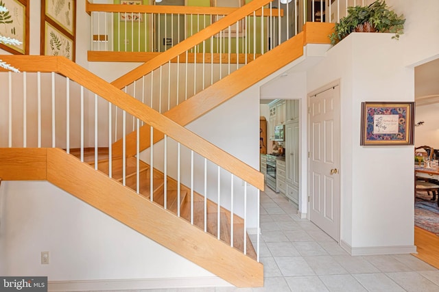 4 Surrey Rd, Rehoboth Beach, DE 19971 - stairs with tile patterned floors and baseboards