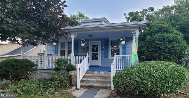 107 E Overlea Ave E, Baltimore, MD 21206 - shotgun-style home featuring a porch