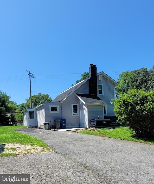 14100 Old Marlboro Pike, Upper Marlboro, MD 20772 - rear view of house with a chimney and a shingled roof