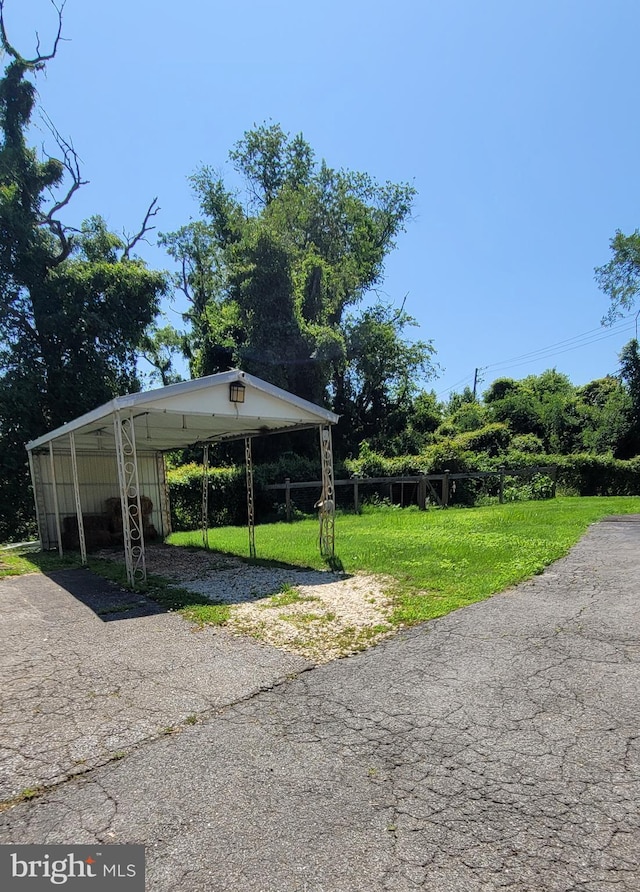 14100 Old Marlboro Pike, Upper Marlboro, MD 20772 - view of parking / parking lot with driveway and a detached carport