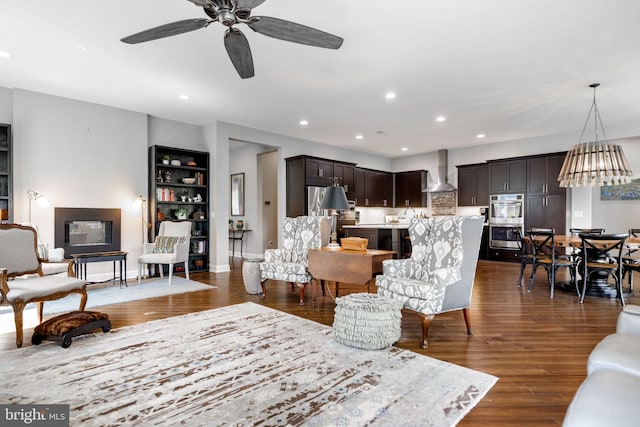 125 Towhee Dr, Lake Frederick, VA 22630 - living area featuring ceiling fan, built in shelves, dark wood-style flooring, and recessed lighting