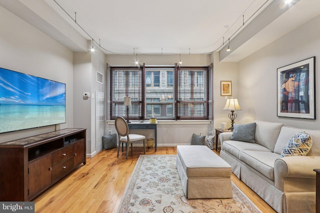 1425 Locust St Unit 7D, Philadelphia, PA 19102 - living room with light wood-type flooring and track lighting