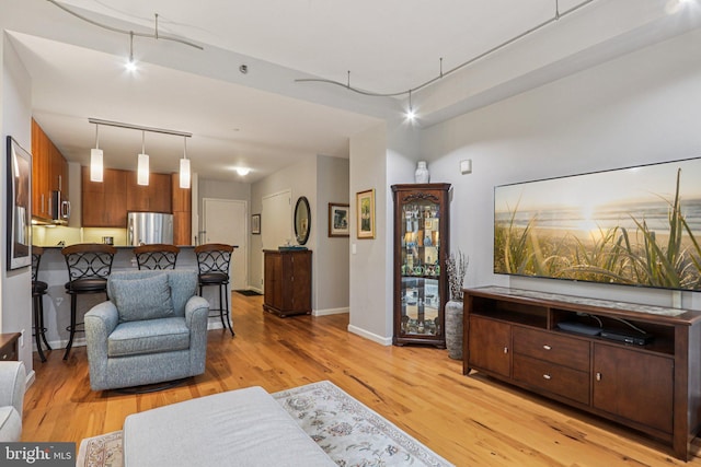 1425 Locust St Unit 7D, Philadelphia, PA 19102 - living area featuring light wood-type flooring and baseboards