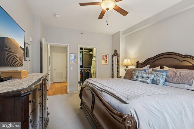 1425 Locust St Unit 7D, Philadelphia, PA 19102 - bedroom featuring light colored carpet, a walk in closet, a closet, and ceiling fan