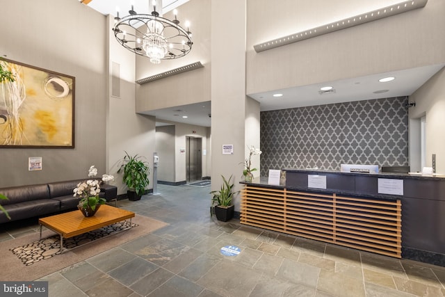 1425 Locust St Unit 7D, Philadelphia, PA 19102 - reception area with a towering ceiling, a chandelier, and a community bar