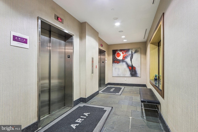 1425 Locust St Unit 7D, Philadelphia, PA 19102 - hall with elevator, stone tile floors, and recessed lighting
